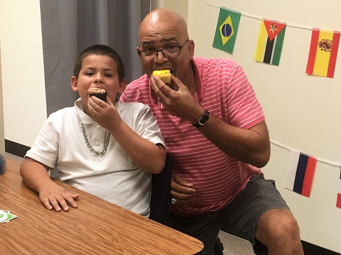 Stony Point Pastor Dexter Sharing A Cupcake With Lunch Buddy